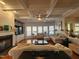 Bright living room boasts hardwood floors, a fireplace, built-in shelving, and sun-filled windows at 502 Willowmere Ct, Cary, NC 27513