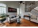 Living room offers windows, a fireplace, hardwood floors, and natural light at 502 Willowmere Ct, Cary, NC 27513