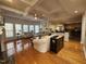Spacious living room featuring a fireplace, hardwood floors, and seamless flow to other spaces at 502 Willowmere Ct, Cary, NC 27513