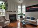 Spacious living room with fireplace, hardwood floors, and natural light at 502 Willowmere Ct, Cary, NC 27513