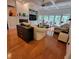 Spacious living room features hardwood floors, a fireplace, and large windows offering ample light at 502 Willowmere Ct, Cary, NC 27513