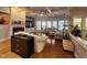 Spacious living room featuring a fireplace, hardwood floors, and large windows at 502 Willowmere Ct, Cary, NC 27513