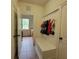 Well-organized mud room with built-in bench, coat hooks, and access to the laundry room at 502 Willowmere Ct, Cary, NC 27513