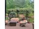 Outdoor patio area with comfortable seating and a pergola covered in flowering vines at 502 Willowmere Ct, Cary, NC 27513