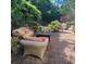 Inviting brick patio with comfortable outdoor seating and lush greenery surrounding the area at 502 Willowmere Ct, Cary, NC 27513
