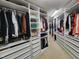 Spacious walk-in closet with custom shelving and ample storage for clothing and accessories at 502 Willowmere Ct, Cary, NC 27513