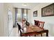 Formal dining room with a large wooden table, elegant chairs, and stylish window curtains at 5163 Sandy Banks Rd, Raleigh, NC 27616