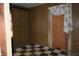 Bedroom with dated floors, wood paneling and boarded up doorway at 537 Homeland Ave, Durham, NC 27707
