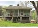 Home with a covered porch and an unfinished crawl space below at 537 Homeland Ave, Durham, NC 27707