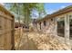 A newly built wooden backyard deck, part of a backyard with a brick home at 5500 Fortunes Ridge Dr # 72A, Durham, NC 27713