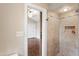 Shower and view into the bedroom with ceiling fan and modern closet doors at 5500 Fortunes Ridge Dr # 72A, Durham, NC 27713
