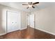 A well-lit bedroom with ample closet space and wood-look floors at 5500 Fortunes Ridge Dr # 72A, Durham, NC 27713