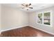 Bedroom features wood-look floors and a bright window at 5500 Fortunes Ridge Dr # 72A, Durham, NC 27713
