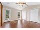 The bedroom features wood-look floors and exterior access at 5500 Fortunes Ridge Dr # 72A, Durham, NC 27713