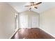 This bedroom has vaulted ceilings and wood-look floors at 5500 Fortunes Ridge Dr # 72A, Durham, NC 27713
