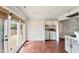 Dining area with hardwood flooring, a door to an outdoor deck, and a laundry closet at 5500 Fortunes Ridge Dr # 72A, Durham, NC 27713