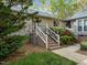 Charming brick townhome featuring a decorative white railing leading to the front entrance at 5500 Fortunes Ridge Dr # 72A, Durham, NC 27713