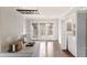 Kitchen with white countertops, a laundry closet, hardwood flooring, and a door to an outdoor deck at 5500 Fortunes Ridge Dr # 72A, Durham, NC 27713
