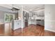 Kitchen featuring stainless steel appliances, painted cabinets, and hardwood flooring at 5500 Fortunes Ridge Dr # 72A, Durham, NC 27713