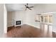 Open living room with hardwood floors, a fireplace, and access to the kitchen and dining area at 5500 Fortunes Ridge Dr # 72A, Durham, NC 27713