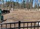 Fully enclosed dog park with wood mulch, benches, and a waste station at 6007 Shade Tree Ln, Durham, NC 27703