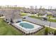An aerial view showcases the pool, common area, and neighborhood at 667 Ashley Woods Dr, Gibsonville, NC 27249