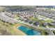 The aerial view shows the surrounding community and a nearby pond at 667 Ashley Woods Dr, Gibsonville, NC 27249