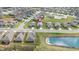 An aerial view highlights the neighborhood layout and nearby pond at 667 Ashley Woods Dr, Gibsonville, NC 27249