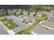 An aerial view shows the community pool and surrounding homes at 667 Ashley Woods Dr, Gibsonville, NC 27249