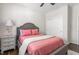 Bedroom features include a comfortable bed, side table, and a closet at 667 Ashley Woods Dr, Gibsonville, NC 27249