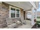 Inviting front porch with seating area, perfect for enjoying outdoor relaxation at 667 Ashley Woods Dr, Gibsonville, NC 27249