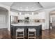 Charming kitchen with a dark wood island, seating, and stainless steel appliances at 667 Ashley Woods Dr, Gibsonville, NC 27249
