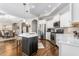 Modern kitchen boasts stainless steel appliances, custom cabinets, and a spacious kitchen island at 667 Ashley Woods Dr, Gibsonville, NC 27249