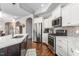 Beautifully appointed kitchen with granite countertops, stainless steel appliances, and custom cabinetry at 667 Ashley Woods Dr, Gibsonville, NC 27249