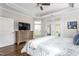 Bright main bedroom featuring hardwood floors and private access to the backyard at 667 Ashley Woods Dr, Gibsonville, NC 27249