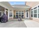 Back patio with comfortable seating around a fire pit and BBQ grill at 667 Ashley Woods Dr, Gibsonville, NC 27249
