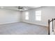Upstairs bonus room with carpet, natural light, and ceiling fan at 68 Tee Time Ter, Benson, NC 27504
