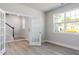 Open living room with wood-look floors, and staircase access at 68 Tee Time Ter, Benson, NC 27504