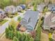 Private backyard oasis with a spacious deck, stone patio, fire pit, and lush landscaping perfect for outdoor entertaining at 8121 Greys Landing Way, Raleigh, NC 27615