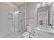 This updated bathroom features a glass door shower and modern fixtures at 8121 Greys Landing Way, Raleigh, NC 27615