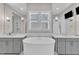 Luxurious bathroom with dual sinks, soaking tub, and stylish finishes at 8121 Greys Landing Way, Raleigh, NC 27615