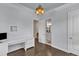 Comfortable bedroom with hardwood flooring, desk, and an ensuite bathroom at 8121 Greys Landing Way, Raleigh, NC 27615