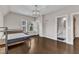 This bedroom has hardwood floors and a view into the bathroom and bonus closet at 8121 Greys Landing Way, Raleigh, NC 27615
