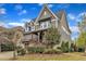 Beautiful two-story home showcasing a covered porch and manicured landscaping at 8121 Greys Landing Way, Raleigh, NC 27615