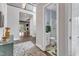 Welcoming foyer with hardwood floors, an eye-catching rug, and a glimpse of the living spaces at 8121 Greys Landing Way, Raleigh, NC 27615