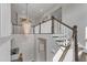 Multi-tiered crystal chandelier hanging above the staircase landing at 8121 Greys Landing Way, Raleigh, NC 27615