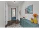Inviting entryway with hardwood flooring, stylish decor, and a charming blue front door at 8121 Greys Landing Way, Raleigh, NC 27615