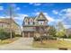 Beautiful two-story home with a covered porch, stone accents, and attached two-car garage at 8121 Greys Landing Way, Raleigh, NC 27615