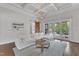 Bright living room with large windows, a plush sofa, and stylish decor at 8121 Greys Landing Way, Raleigh, NC 27615