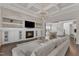 Open concept living area with fireplace, built-in cabinets, and a dining area visible at 8121 Greys Landing Way, Raleigh, NC 27615